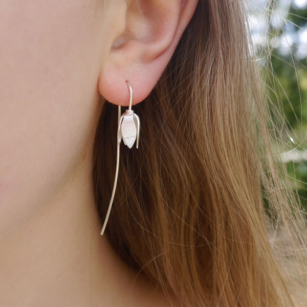 snowdrop flower long stem silver earring worn